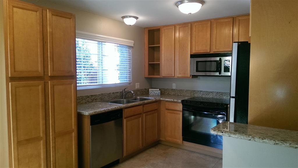 Pride of Ownership in this well maintained ground level end unit with a usable patio and side yard, tall shade tree, potted plants remain. Finished dry walled shed with electricity. New upgraded carpet and pad. New stacked washer & dryer. Granite counters, stainless steel appliances. Custom pantry with pullout drawers. Custom Blinds with Valances. Travertine tiled baths. Mirrored wardrobe doors. Dual pane windows Gated complex, Two dedicated parking spaces one covered. Community pool. Move Ready. Neighborhoods: El Cajon Equipment: Shed(s) Other Fees: 0 Sewer: Sewer Connected Topography: LL