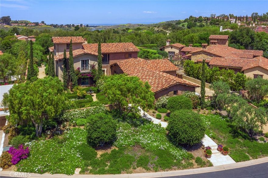 Live in the prestigious community of Shady Canyon in an alluring freshly updated Tuscan farmhouse inspired home showcasing a compound perfect for entertaining or relaxing in a secluded sanctuary. This exceptionally designed home offers spacious living in every room, natural light beaming throughout, no interior steps on the first level and it’s nestled on a small cul-de-sac of just 10 estates. The unbeatable layout includes a main floor master suite plus an additional en-suite bedroom, three huge upstairs en-suite bedrooms & a convenient separate casita with a kitchenette and bathroom. In addition, it boasts an upstairs bonus room with access to a large view balcony, a third-floor view loft, butler’s pantry, mud room & a plethora of storage. Seventeen sets of French doors open to lushly landscaped grounds & to pastoral views from the upstairs balconies. Showcasing unbridled privacy, the beautifully landscaped grounds include a front courtyard with sculpted gardens surrounded by roses & citrus trees, a backyard with forever greens, a saltwater pool & spa, private BBQ & a centrally located loggia to enjoy year-round alfresco dining. A gated driveway expands to an easy access 4 car motor court. You’ll feel a sense of solitude living here & never tire of calling this home. Meticulously presented, inside & out. Award winning schools. Live within 10 minutes close to world class shopping, restaurants, resorts, beaches, freeways, John Wayne airport & more! https://vimeo.com/410464960