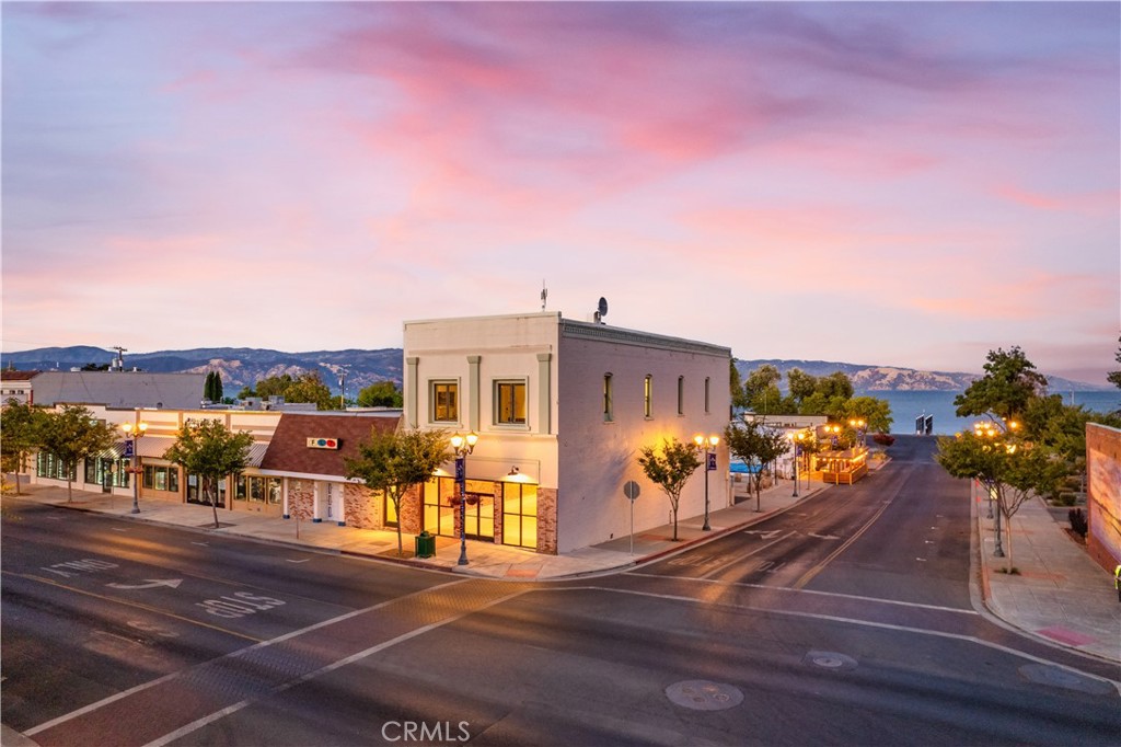 Incredible opportunity to own a historic yet modern property in the most prime location in Lake County’s burgeoning commercial real estate market. Located in the heart of downtown Lakeport and only steps away from the lake, the property offers prime visibility, accessibility, and proximity to dining, shopping, and recreation. Discover an extraordinary versatile mixed-use retail and multifamily building that seamlessly blends historic charm with modern upgrades, making it a standout investment. The entire building was taken down to the studs and expertly renovated between 2018 and 2022 with no expense spared. The full renovation of this property has transformed it into a modern, high-tech masterpiece, where only the finest quality fixtures and finishes were meticulously applied, creating a pristine and sophisticated offering. Fabulous retail or gallery space on the main street level featuring soaring 13-foot-tall ceilings with gorgeous historic brick walls as a backdrop. Complimented by modern high-end lighting, mini split systems for heating/cooling, multiple storage rooms, and restroom. With its own designated street entrance, upstairs you will find TWO luxury apartments currently operating as successful 5 STAR vacation rentals. The first apartment overlooks main street and has views of the Courthouse Museum Square and clock tower. In the secondary apartment you will find amazing lake views you can enjoy from the private balcony overlooking Clear Lake and Library Park. Prepare to be stunned by the design features of these 2 units including uniquely tiled bathrooms, custom vanities, luxury vinyl plank flooring, recessed lighting, custom cabinetry, LG ThinQ smart appliances, mini split systems, big picture windows and so much more. Other infrastructure upgrades include professional alarm system and fire sprinklers with alarm going directly to the fire station. The building enjoys free Wifi as it houses a satellite on top that provides services for the downtown area. 2 parking spaces included on the backside of building leading to the back entrance of the main floor. Zoned Central Business allowing for many different uses including retail, cafe, bars/taverns, professional offices and much more. Don’t miss this amazing opportunity for a truly turnkey investment property offering endless possibilities!