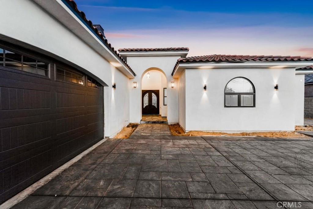 Welcome to a masterclass in new construction, 42730 23rd street west. Impeccably designed and expertly built by SBH this home exceeds expectations with every detail and sets a new bar for the sophisticated comfort of luxurious living. The interior living space encompasses approx. 3,700 sq.ft of well laid out open floor plan, including 10'-12' ceilings throughout with five bedrooms and four bathrooms and a powder room. A gracious entry sets the tone with an over-sized Door and upgraded flooring. Enjoy using the versatile great room featuring an eat-in kitchen with custom countertops, cabinetry, stainless steel appliances, 48'' stove with hood, extra large sink, and a butler's pantry with space for a 48'' wine cooler. You will find multiple fireplaces, recessed lighting. Retreat to the private master suite and bath boasting designer tile arrangements, extra large shower with his n hers shower head & a handheld spray, free standing tub, and large walk-in Closets. Master restroom & powder room with high end toilet & bidet.
The family room features a massive foldable door which allows you to bring this magnificent inside to the equally expansive covered patio area for extra space to entertain friends and family. Did I mention that this patio also comes with a fireplace, as well as fittings for your dream outdoor kitchen that will satisfy the chef in the family.
The rest of the backyard is an open flat canvas that is ready to accommodate your oasis in the valley.
Sitting on over 1/2 acre, there is room for an RV garage, a huge pool, and toys
This home will come with three over sized car garages, and option to add RV garage. Whole house highlights include solar system per code, tankless water heater. Ideally located on westside of fast growing city of Lancaster and minutes from the best shopping, restaurants, parks, freeways, and train station.