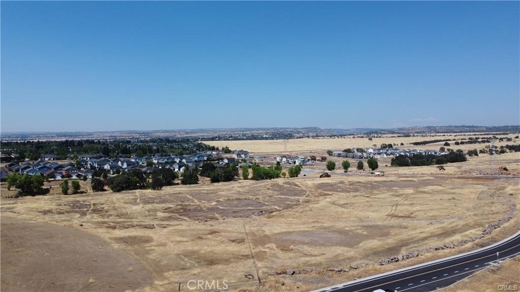 This is a prime 2.34 acre lot in a prime area of commercial development with Native Oak Dr, Yosemite Dr and Humboldt Rd surrounding the property. The parcel has been subdivided with improvements recently completed including road, curb, gutter and utilities in the frontage, the road has also been extended across the creek. This is a site ready for development next to several other completed projects. Neighboring projects include DR Horton's Sparrow community of 86 homes, Oak Valley subdivision, Lava Ridge Apartments, and other multi-unit projects in the final phases of construction. The property has been subdivided to this final acreage with senior housing planned on the adjacent parcel to the West/South West. This parcel is zoned R2 - Medium density with an allowable density to 14 units and focusing on housing for development compatibility with Chico's general plan. Beautiful location with approximately 2.2 miles to services like Target, Winco and more.