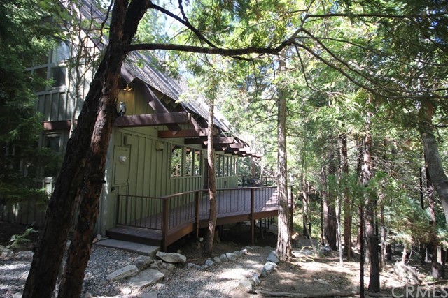 Amazing Lakeside living in this unique 3 bedroom, 2 bath Lake rights home nestled in the trees with great decks and outdoor living space. Just steps to your single slip (N501B) dock to continue your perfect outdoor entertaining package. This is a must see property!