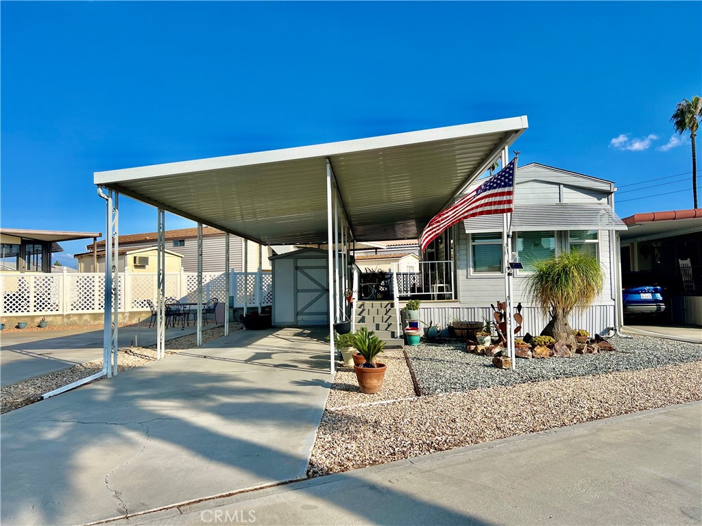OWN YOUR LAND! Desired Mountain Shadows RV Resort 55+ Gated Community. Beautiful Castle 1989 Park Model Approx 400 Sq Ft Of Living Space. Full Length Covered Patio Is Great For Enjoying Your Favorite Morning Or Afternoon Beverage. Enter Through The Sliding Glass Doors To The Open Floor Plan Kitchen With Full Size Refrigerator, Free Standing Propane Stove, Microwave, Garbage Disposal & Lots Of Extra Cabinetry & Custom Pull Out Drawers. Open To The Living & Dining Room With Built-In Hutch. The Master Bedroom Has Mirrored Wardrobe Closet Doors. Bathroom Has Vanity & Shower Tub Combo. Newer Interior Paint, Laminate Wood Flooring, Mini Split AC/Heating Unit & Electric Hot Water Heater. Improved Storage Shed Has Washer & Dryer Included. The Land Is An Oversized "A" Lot Approx 2614 Sq Ft. Covered Carport & Low Maintenance Landscaping. Two Clubhouses To Choose From With Lots of Amenities Including Heated Salt Water Pool, Spas, Indoor & Outdoor Kitchens, Auditorium, Billiard Room, Shuffleboard, Gyms, Laundry Facilities, Restrooms & Showers, Horse Shoe Pit, Corn Hole, Ping Pong Tables & More. LOW TAXES & HOA FEES Of Approx $292.00 "ONLY" A Month Includes Water, Sewer, Trash Basic Cable & Internet. Turnkey & Move In Ready! Retirement At It's Finest!