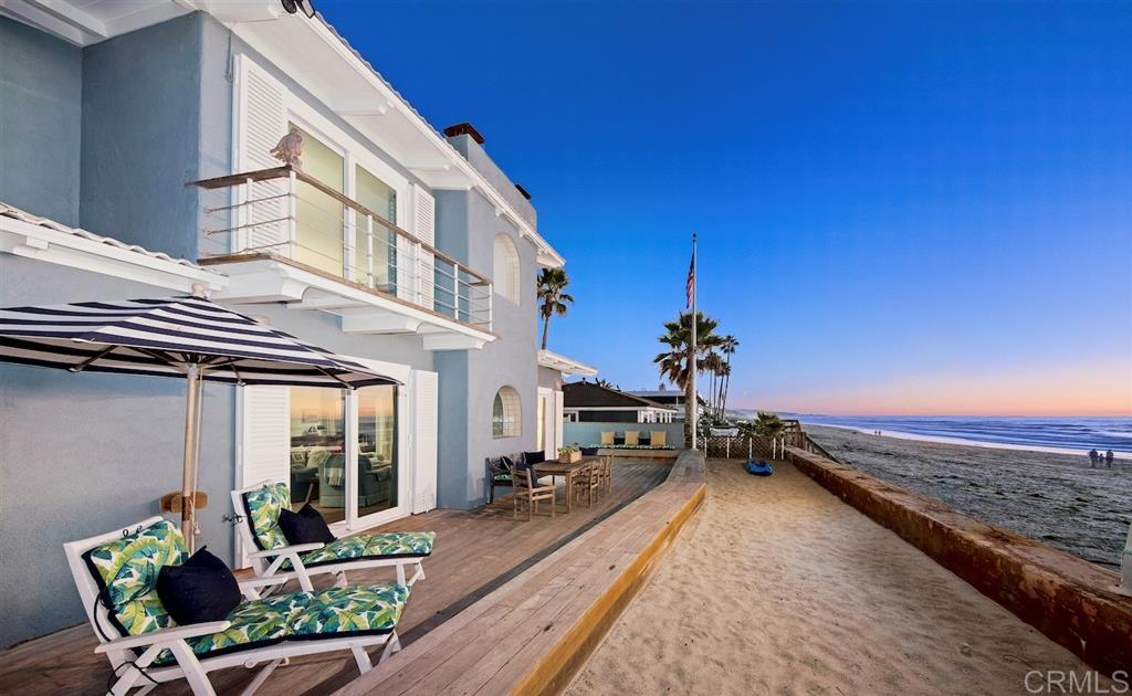 Showcasing 50ft of ocean frontage w/direct beach access on Del Mar's most coveted stretch of sand, this idyllic beach haven, on an oversized 1/2 acre lot, presents 5 bedroom suites, including an oceanfront Master w/view deck, and room to expand. Fresh ocean breezes, picturesque sunsets & the sounds of the ocean are your constant companion. Southern exposure and the indoor/outdoor living spaces create the ideal home for enjoyable family living & entertaining. Located in the Sandy Lane private gated community. Additional property highlights include: 3-car garage plus private (on-site) parking for 15 additional cars * Beach bathroom and outdoor shower * Protective seawall * Direct beach access - you are steps away from a ~3 mile sandy beach walk from Dog Beach to Torrey Pines State Beach (at low tide) * Walk to world class dining * Take in Del Mar Racetrack * Oversized parcel offers opportunity for creative expansion: ADU, extra garage(s), pool, additional living space, or whatever your dream life entails * Tucked away at Sandy Lane, life becomes your own private haven.