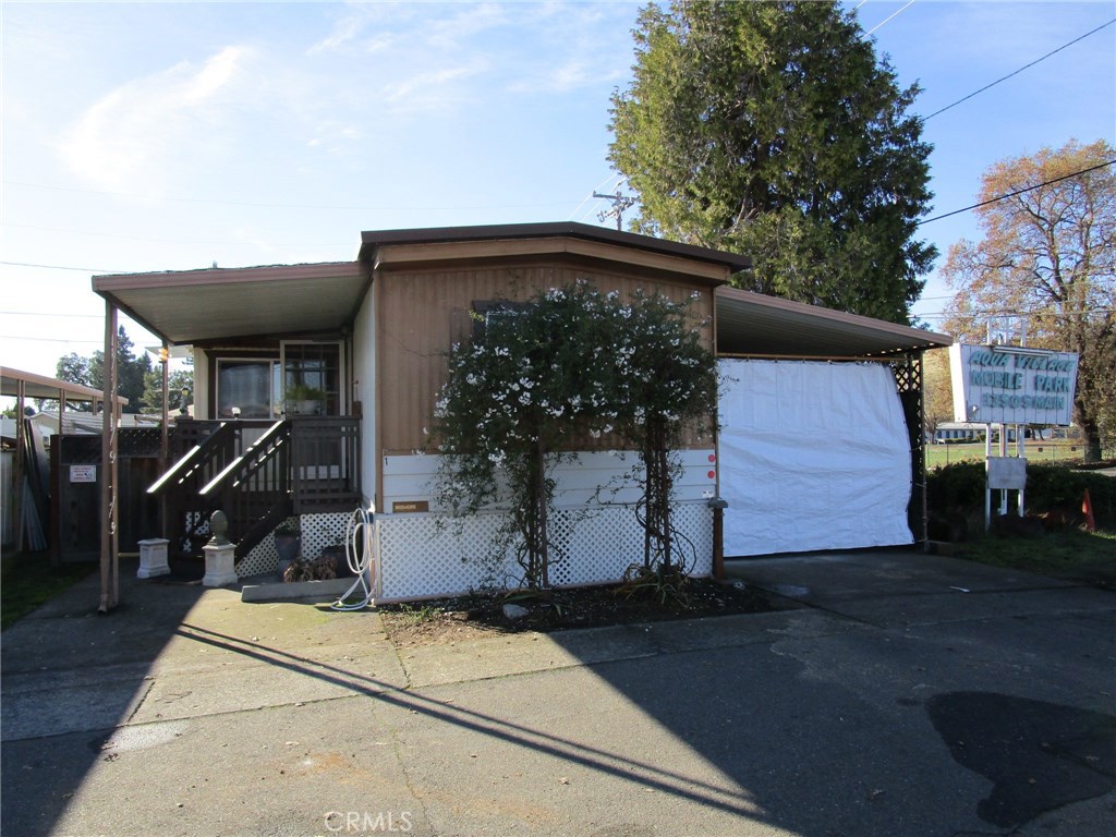 Come see this Charming single wide mobile with a pop out. This home is in a lakefront park with marina and features 1 1/2 bathrooms, one bedroom room, and an extra craft room that could easily be converted back to a two bedroom. Has an out door shed plus large workshop. covered carport. Large back yard with fresh Healthy grass. Comes with electric washer and dryer, propane heat and stove. Close to downtown and shopping for your convenience