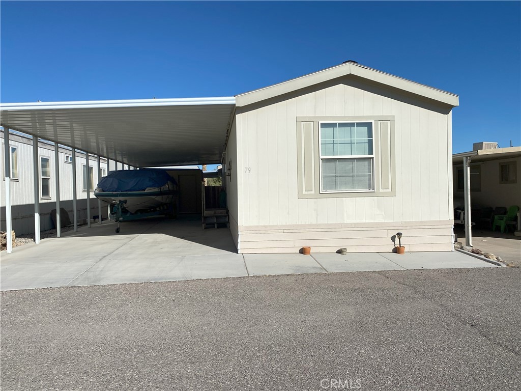 Nice home! Take a short little walk to get to the Beautiful Havasu Lake. Fully furnished, appliances included. A/C-Heat, roofing in good condition, checked on the regular. Flooring in good condition! Covered Parking, Ready to move in!