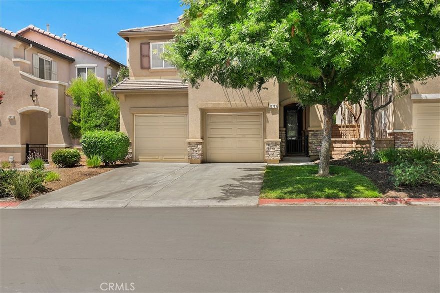 Welcome to this gorgeous home with a desirable floor plan tucked into the Cobblestone at Stoneridge Ranch gated community. Enter into the foyer that opens up into a spacious formal living room with vaulted ceilings throughout the main level. Through this area is an open floor plan with the kitchen, living room, and dining area. The kitchen features granite countertops with a breakfast counter with bar seating. The two-car garage is accessed from a door in the hallway. There's a glass sliding door off this main level leading out to the private patio space for that easy flow to enjoy indoor/outdoor living and dining. Upstairs are the four bedrooms, a versatile loft space, two bathrooms, and the laundry room. The primary suite features an en suite bathroom and a walk-in closet. The amenities offered here are controlled access, grassy areas, concrete walkways, picnic benches, a basketball court and a playground. This wonderful home is conveniently located near local markets, shopping centers, schools, and freeways.