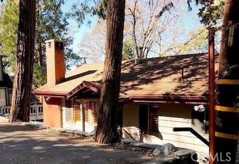 Adorable three bedroom, two bath home with a cozy brick fireplace, vaulted ceilings, and large party deck. One bedroom and bath are on the main level, two bedrooms and one bath on the lower level with outdoor access from each bedroom. The laundry area is on the lower level. This full-e home or vacation home is located in the best area of Cedar Glen with LACSD water and sewer. Situated on a street to street lot with parking on both sides and features a storage shed. Great location that is walking distance to restaurants, shopping and the post office. Street is Fir Terrace.