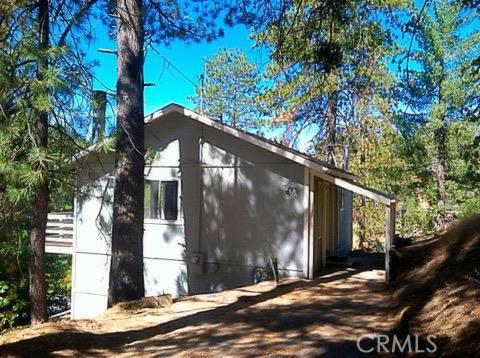 Perfect Location! This mountain home is great for skiers, hikers or for you down-the-hill commuters! The open floor plan has master bedroom and bath on the main level and two bedrooms and one bath on lower level. Newer floors, windows, hot water tank and heater along with a fresh coat of paint will make this home cozy for the next owner. Great for rental use or a vacation getaway!