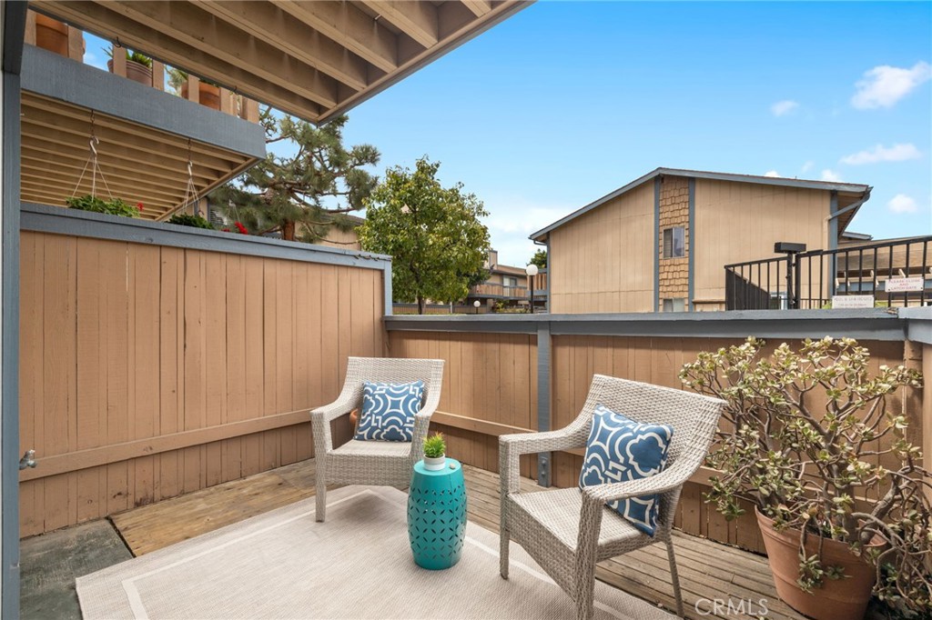 LOCATION, LOCATION, LOCATED IN THE HEART OF HUNTINGTON HARBOUR WALKABLE TO THE BAY AND BEACH. THIS 3 BEDROOM WITH 1 BEDROOM ON MAIN LEVEL AND 2.5 BATHROOMS TOWNHOME COVETED IN THE SEASCAPE COMMUNITY!!.. IS THE ONE YOUR CLIENT HAS BEEN WAITING FOR. BEAUTIFUL WOOD FLOORS, CROWN MOLDING, RECESS LIGHTING AND SEVERAL CEILING FANS THROUGH OUT. UPDATED KITCHEN WITH GRANITE COUNTERS, TILE FLOORING & STAINLESS STEAL REFRIGERATOR. FRONT PATIO OFF OF LIVING ROOM PERFECT SHARING A GLASS OF WINE. UPSTAIRS OFFERS A HUGE MASTER BEDROOM WITH WALK IN CLOSET, PRIVATE BALCONY AND ENLARGED WALK IN SHOWER. SECONDARY BEDROOM IS GENEROUS IN SIZE WITH IT VERY OWN LARGE ROOF TOP BALCONY!! 2 CAR GARAGE W/WASHER & DRYER HOOK UPS. THIS GREAT UNIT IS STEPS FROM TRADER JOES, RESTAURANTS AND MUCH MORE! COMMUNITY FEATURES GREEN BELTS, FENCED IN POOL & HOT TUB, TWO STORY CLUB HOUSE WITH KITCHEN AND POOL TABLE PERFECT FOR ENTERTAINING, AND A FULL SIZED LIGHTED TENNIS COURT. DID I MENTION THAT HARBOR VIEW ELEMENTARY IS JUST 2 BLOCKS AWAY!! (THIS 3 BEDROOM FLOOR PLAN RARELY COMES UP)