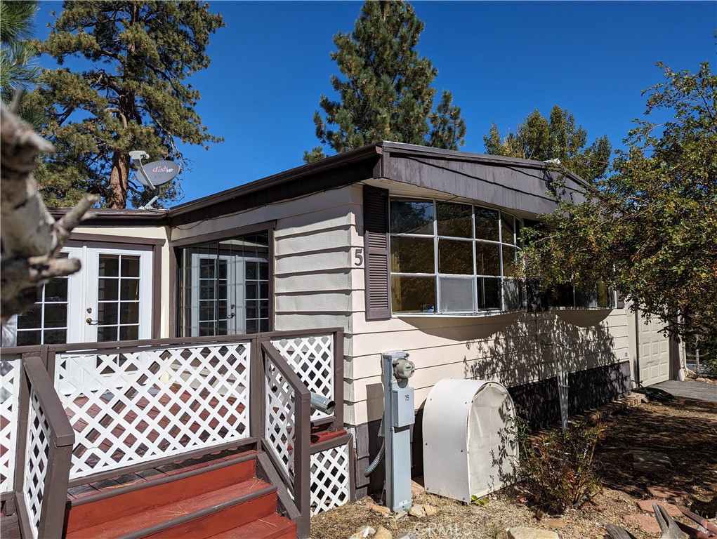 Extra! Extra! Read ALL About It! This coach is a diamond in the rough and loaded with extras: To Start there are 2 large living spaces, the living room and the family room plus formal dining. Front and rear decks. A 24x11 Summer room (264sq' not included in the square footage) Tandom garage 13'x35' (455sq') a 10'x22' (220sq' workshop) and a 10x10 storage shed connected to the workshop which is connected to the garage. The Pellet Stove will heat the entire coach. 2 greenhouse windows in the living and dining rooms. Mirrored wardrobes in all the bedrooms. There's no denying this home is prime for an update. You will be surprised by the size and storage. An easy walk to the park's Park, Pool and Spa. Don't forget the rear yard, plenty of room to do your ' landscaping thing'. Come be delighted by this 'Own your own lot' Community. Owners will give careful consideration to all offers.