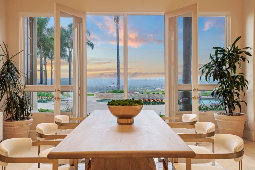 Set behind the gates of Del Rayo Estates is this custom 6+ bedroom Mediterranean home privately located on an elevated site to capture panoramic mountain and valley views. The single level home boasts a thoughtful floorplan that flows smoothly with high ceilings welcoming in natural sunlight from almost every room. The primary bedroom suite, wood paneled office, and adjacent bedroom are located at the east end of the home while the oversized family room, gourmet kitchen and 4 additional bedroom suites are located on the west wing. The massive windows in the voluminous rooms take in the stunning view. The main rooms all open onto a beautiful manicured 2.32 acres with a soccer field sized yard, resort pool & spa, north/south tennis court, and a 2 bedroom guest house with entertaining BBQ area. It feels like your own private resort with plenty of space for gatherings, complete with 6-car garage spaces and room to accommodate up to 10 additional cars. The location is ideal being just minutes to restaurants, Rancho Valencia, shopping, beaches, and the I-5, all while still enjoying the quietness and privacy that the home offers. Recent upgrades include a partial home electrical generator system that powers some lighting, freezers, and refrigerator. Come enjoy the Rancho Santa Fe resort lifestyle.