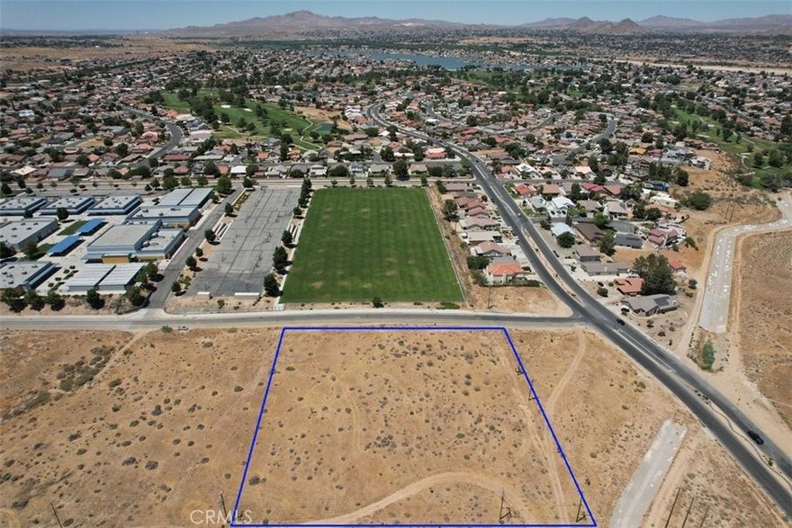 Magnificent elevated lot overlooking Spring Valley Lake Community. Land is zoned R2 which allows for a 20 unit apartment building. This property would be highly desirable for rental income from its proximity to Spring Valley Lake and Victor Valley College. Utilities are close to the subject property.