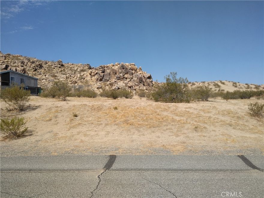 Commercial lot (C-RU) on main street of Lake Los Angeles, Adjoining lot also available.  Electric & Water in the street.  Buy one or both!  Seller will consider financing with a minimum 60% down for a term not to exceed 36 months.   *Buyer to make their own independent investigations regarding zoning & General Plan Designations, Hazard Zones, Availability & Costs of utilities.