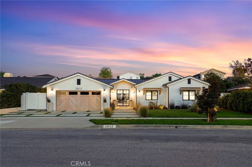 Luxury living awaits in this impeccably newer construction abode nestled in the prestigious Eastbluff neighborhood. This single-story residence epitomizes refined living, showcasing meticulous craftsmanship and modern coastal farm house elegance at every turn. As you enter, lofty vaulted ceilings create an expansive atmosphere, seamlessly blending contemporary sophistication with timeless charm. Spanning 3,232 sqft on a generous 11,220 sqft lot, this fully upgraded home offers unparalleled comfort and convenience. Every detail has been carefully redesigned, ensuring a worry-free lifestyle with new plumbing, HVAC, electrical, and roofing systems. The heart of the home is its gourmet kitchen, featuring a spacious island adorned with luxurious quartzite countertops and equipped with top-tier Thermador appliances. Whether hosting intimate gatherings or culinary adventures, this kitchen caters to the most discerning tastes. Entertain effortlessly in the adjoining living spaces, graced with wide plank European white oak flooring that defines stylish yet inviting living. A wet bar with a beverage refrigerator and ice maker invites relaxation and indulgence. Retreat to the private quarters, where each bedroom boasts its own en-suite bathroom for ultimate comfort. The primary bedroom suite offers a private coffee bar, dual expansive walk-in closets, and a dedicated laundry area. The spa-like primary bathroom is a masterpiece, featuring dual showers, vanities, and water closets. Step outside to your own private oasis, complete with a brand new pool for summer refreshment and a built-in barbecue area for alfresco dining. A cozy firepit amidst lush landscaping sets the stage for evenings of tranquility and relaxation. Nestled within this exceptional residence, you'll enjoy proximity to renowned schools like CDM High School and Eastbluff Elementary, as well as upscale shopping at Fashion Island and the pristine beaches of Newport Beach. Discover the pinnacle of luxury living in Newport Beach at 2812 Carob Street—a turnkey masterpiece awaiting your arrival. Don't miss this unparalleled opportunity to call this extraordinary residence home.