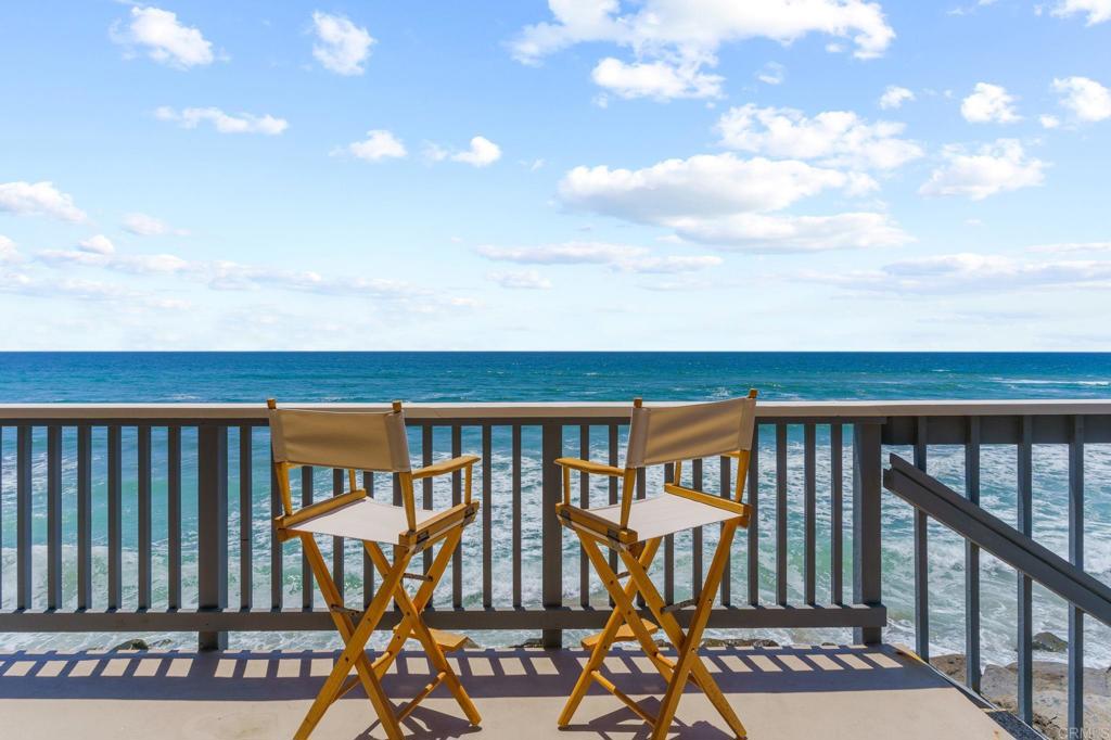 Experience pure bliss while staring over blue ocean and white water, completely uninterrupted. Watching the surfers, seagulls skimming the water, and the ever-changing sky over the ocean will captivate you. Feel the fresh ocean air and let your worries melt away. This condo offers one of the more spacious decks in this small complex, with plenty of room to lounge, entertain, or outdoor dine. A private beach right below your deck is the perfect scene for spending long summer days with your toes dug in the warm sand. In the evenings, cozy up next to the fireplace with a stellar view of the sunset over the water. This is the ideal ocean front condo, suitable as a pied a terre, part time or full time resort-style living. In-unit laundry is conveniently located in master suite closet, building has lobby w/ elevator, gated garage with visitor parking, and community sauna. Take a nice stroll to the iconic Oceanside pier, fine dining restaurants, or the weekly sunset market. Do not miss this opportunity to own your own slice of paradise right on the water!