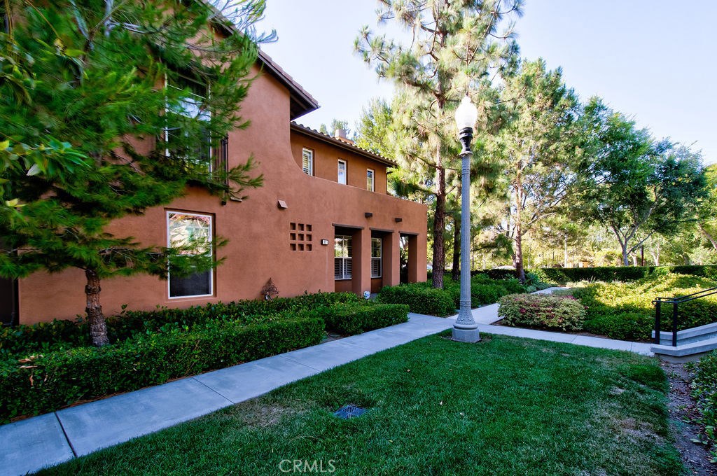 Enter into this amazing beautiful home situated in a very nice and convenient location in the Quail Hill community.This home is just steps away from the clubhouse, fitness center, pool & spa, and park area. A short walk to the Quail Hill Shopping Center for your morning coffee and shopping and shady canyon hiking trails. Attached only in one side enter into the living room with vaulted ceiling, auto start gas fire place, with plenty of lights and ample windows. To the left is the extra large kitchen with granite top countertop and maple cabinetry. The feature of the living and kitchen is the 22 foot high ceiling which allows for plenty of natural light into the property, creating an open space feeling. The home features a separate step up dining area. Main floor bedroom and bath downstairs is very convenient for elderly parents or over night guests. Upstairs master suite has a walk in closet and spacious bath and shower area. The 3rd bedroom is very bright with plenty of windows. Enjoy work from home on the second floor office den in the hallway with builtin cabinets large enough for two person work. The oversized 2+ car garage can accommodate an extra car or workshop. The association has plenty of amenities like Gym, tot lot, park, spa and pool.The unit is immaculate and has brand new carpet and paint. This unit is conveniently located a short drive to the Orange County Airport, the Spectrum Shopping center and easy access to 405, 5 Freeways and also the 73 toll road.