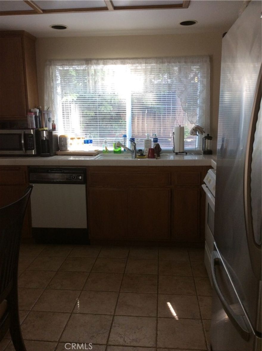 Single family detached home in quiet neighborhood.  Great backyard for outdoor.   House has great natural lighting and a welcome atmosphere once step in thru front door.  High ceiling. Downstair has new flooring. Easy access to freeway 5 and nearby shopping plaza.