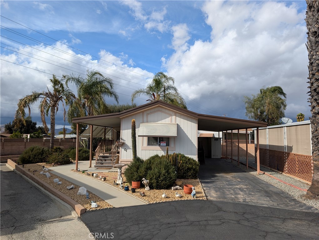 ***LOW LOW PRICE!!***LOWEST PRICED MANUFACTURED HOME IN 55+ EDEN ROC MOBILE VILLAS AT ONLY $24,900!!***BUY A HOME FOR THE PRICE OF A CAR!!***SUPER LOW PROPERTY TAX!!***PARK SPACE RENT IS $850.00 A MONTH (Buyer Must Qualify with Park Office to Lease the Mobile Home Space. Buyer Must Show a Monthly Income of between 3X to 4X the Monthly Space Rent)***Probate Sale - No Court Confirmation Required***This Small but Mighty Home Boasts a Spacious Family Room with Cathedral Ceilings, Cozy Kitchen with Endless Counter Space - Tons of Cabinetry - Pull Out Pots n Pans Drawers - Gas Stove/Oven and Refrigerator, Indoor Laundry Room with Stackable Washer/Gas Dryer (Electric Dryer Outlet Available), Full Bath with Shower/Tub Combo, Primary Bedroom with Full-Wall Closet (3-Doors), BONUS ROOM Measures 7.5' x 11' (Could be a 2ND BEDROOM w/o Closet), Large Covered Front Entry Porch, Covered Back Porch, 2-Car Carport with Wheel Chair Ramp Access into House, 2 Large Sheds with Tons of Shelving, CENTRAL HEAT & AIR, Ceiling Fans, Beautiful Landscaping and So Much More! This Gem is Excellently Located on a Corner Bend in the Park and Has a Walkway that Runs Along it Leading into the North Park Area (Perfect for Bike Rides and Walks)! Eden Roc Mobile Villas is a Senior 55+ Gated Community that Offers a Clubhouse with Kitchen for Events, Library, Pool/Sun Deck, Shuffle Board and More!
