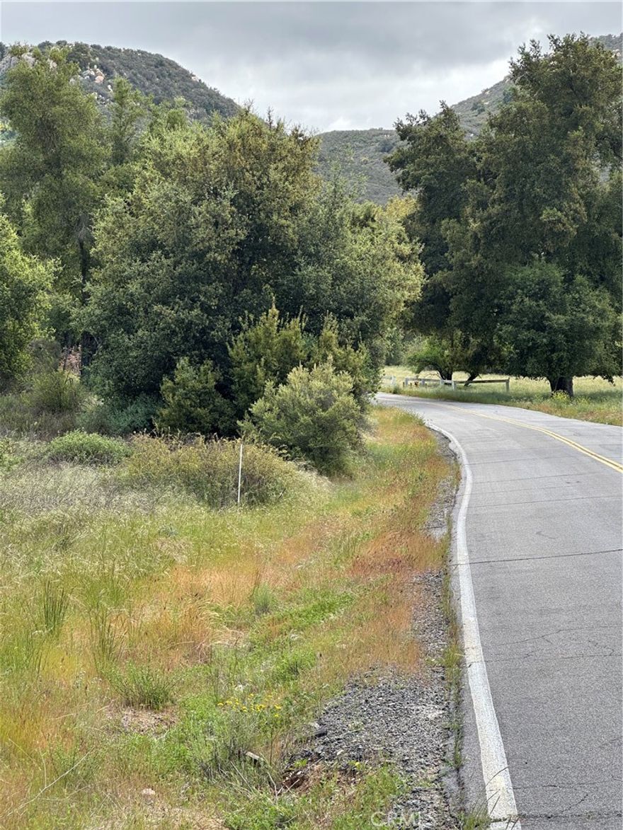 Gentle rolling to hilly 9.89 acre loaded with ancient oak trees with amazing breathtaking views from building pad area on top of parcel. Fronts on paved Hombre Lane, with city water, power & phone in Hombre Lane. Part of La Cresta Highlands community. Area of gorgeous mansions & estate homes. Only a few short minutes back to the 15 freeway at Clinton Keith Road. Area is next to Temecula Valley Wine Country & Vineyards, close to Pechanga & Pala Casinos for adult entertainment. Conveniently between Los Angeles, San Diego & Riverside. This parcel is begging for you to build your dream mansion.



Do Not use the existing path that goes to the building path area as a portion of the path crosses on to the neighbors 10 acre and is not a part of the sale, and using said path constitutes trespassing. Will need to have an engineer draw up a grading plan for alternate access to the building pad area, then hire a grading contract to install a new driveway to the building pad area.