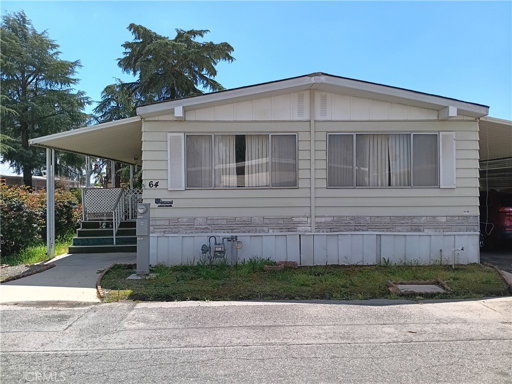 This Home is Priced to sell and won't last. Welcome home to this diamond in the rough. It is a 1975 manufactured home in need of some TLC and cosmetic updates. It is priced accordingly and is being sold in AS-IS condition. It has a large living room, dining room, kitchen, and bonus room (den or office). Featured is an indoor laundry room and a nice-sized kitchen with a newer stove. A large soaking tub is included in the main bedroom, as well as roomy closet space. Enjoy 2 beds and 2 baths. Each bedroom has an attached bath. The home sits on a corner lot with plenty of shade trees for outside entertaining as well as extra storage units. The interior furnishings can be included in the purchase if you choose. This cozy home will not last. All prospective buyers must be park-approved.