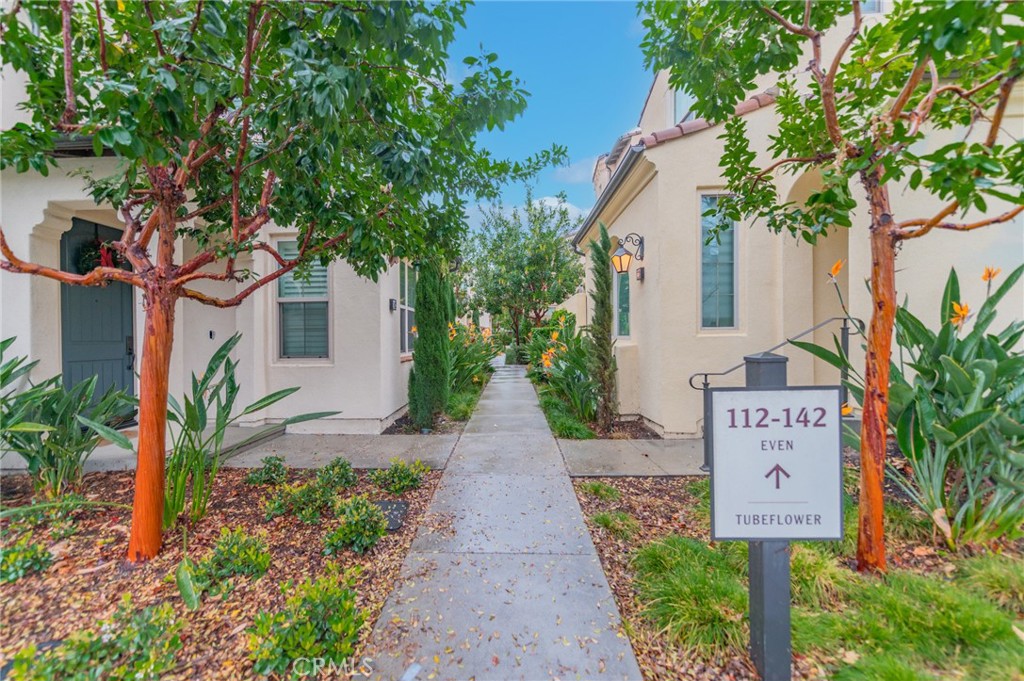 Location! Desirable Cypress Village location and access to community parks, pools, and walking trails. The Great Park is just across the street. This bright and sunny home features 3 bedrooms, 3.5 baths. Contemporary Kitchen includes white Thermofoil cabinetry with Pental Quartz Countertops in Lattice and Island seating, Bosch Stainless Steel appliance package with range, dishwasher, and microwave/hood—private deck located off of the dining area for casual entertaining. Three spacious private bedrooms, two on the upper level and the third on the first floor are great for families and singles. Two-car garage with direct access. Minutes away from shopping and dining restaurants in Woodbury and Cypress Village Shopping Center, Irvine Spectrum.