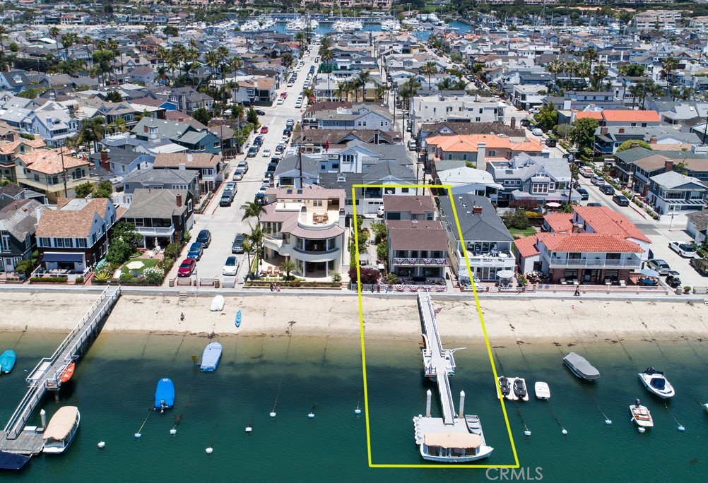 A rare, one-of-a-kind South Bay Front opportunity is finally being offered. This exceptional 45-foot waterfront lot (1 1/2 lots) also has a coveted private dock! The well-cared for home has a wealth of character, history and Balboa memories. Locals will immediately recognize the architecture and craftsmanship of a YALE built home. There are a total of 6 bedrooms, formal dining, spacious waterfront living room, office and terraces front and back. In addition, there is a charming 2 bedroom apartment that is separate and private. The creme de la creme is the show-stopping garden gracing the entire length of the home with dining and entertaining areas perfect for large gatherings of family and friends. The sandy beach and private dock make this a perfect package!