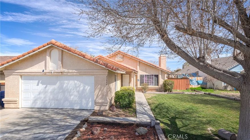 Welcome to this stunning Lancaster home, beautifully located on a charming tree lined street. Perfect for those seeking a single story, Three Bedroom, Two bathroom, with RV Access in a wonderful neighborhood. Home is situated adequately on a 6,000 square foot lot. Immediately, you´ll be drawn into the spectacular curb appeal, large front yard, mature tree, and lush green landscaping. This home is a must see, sure to please all your guests! As you enter, you'll be amazed with a large living room, cozy fireplace, and an adjacent dining room. The family's chef will definitely love the abundance of cabinetry in the kitchen, plenty of counter space, garden window, and sliding doors leading to the backyard. All bedrooms are of ample size with a full bathroom conveniently located amongst both rooms. If you think that's all, wait and fall in love with the Grand Master's Bedroom! Spacious room with a private bath and a walk in closet. Home is equipped with central AC/Heating, washer/dryer hookups, and a two car-attached garage. Large backyard with concrete patio, garden beds, wood fencing throughout, and RV Access! Just minutes from the 14 Freeway, near grocery stores, restaurants, shopping, schools, and parks. Overall, the home is well kept!