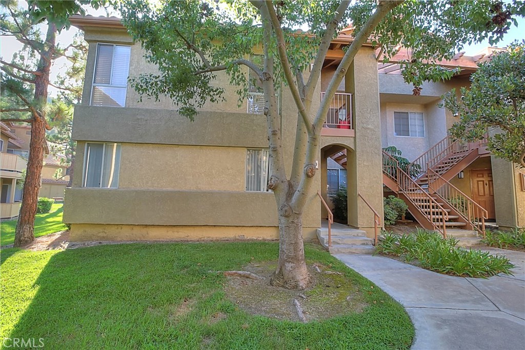 Truly a beautiful and secluded upper level end unit nestled in "The Hills" of Yorba Linda. Move in READY! This is a beautiful two bedroom and two bath clean condo unit. Master bedroom with sliding door out to balcony. Tons of kitchen cabinet storage, sliding door that leads out to balcony, and more. Cathedral ceilings in dining room/area. Granite counter-tops in the kitchen, and in the both bathrooms. Both bedrooms have large walk-in closets. Living room has a cozy fireplace and a lot of natural light. Recessed lighting throughout. There is a laundry room/closet off the wrap around patio. Conveniently located near the toll road, 55 & 91 and plenty of shopping. Close to Yorba Linda Regional Park and the bike/walking trails. You can enjoy the association pool, spas, fitness center, tennis courts, and playground!