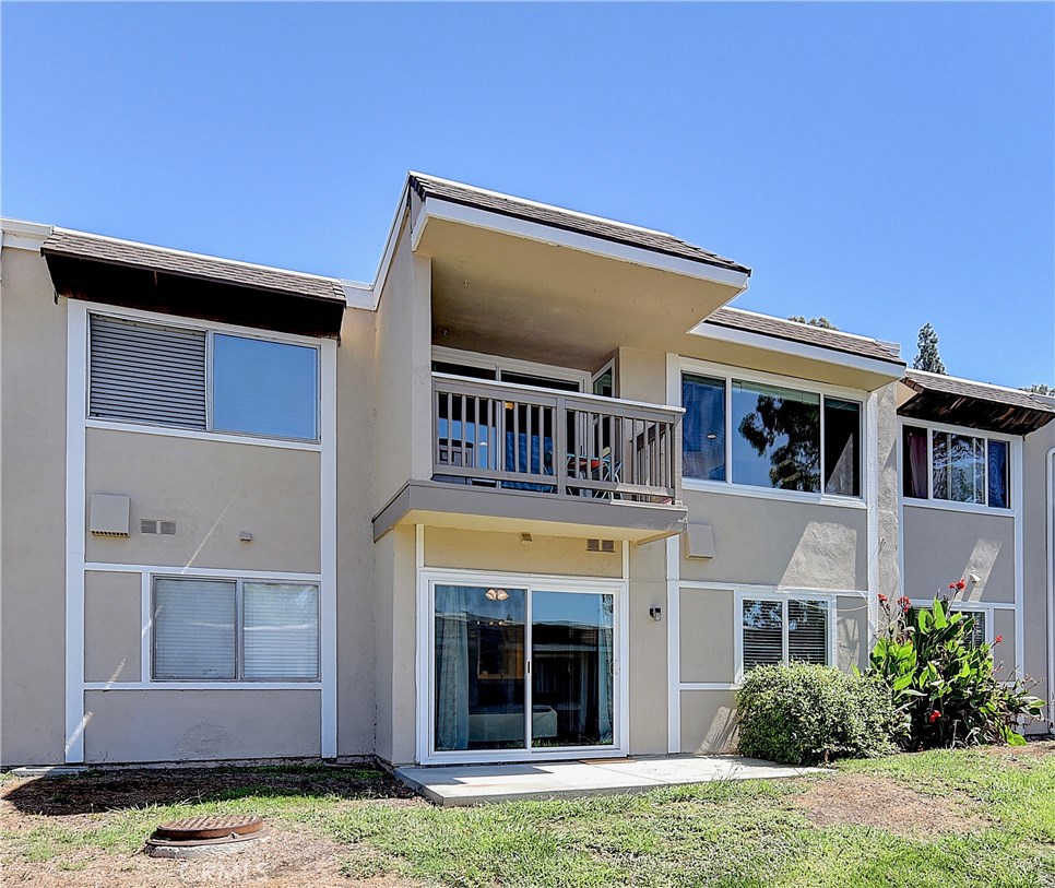 Beautiful two level condo nestled in the highly desirable Laguna Village. The gorgeous remodeled kitchen, dining room, living room, and a bedroom and bathroom are all located on the main level. All other bedrooms and a full bathroom are on the bottom floor providing an extra layer of privacy. Dining area leads to the spacious private balcony where you can relax and enjoy the view overlooking the mountains and city lights! Downstairs is an additional bedroom, bathroom and a master bedroom with direct access to a luscious greenbelt with the option to add a fence for privacy. Includes a one car attached garage and a carport that can be used as a private courtyard. Plenty of guess parking close to this unit. Laguna Village offers a variety of community amenities including Service Patrol, pools, spas, clubhouse, volleyball, basketball courts, tennis courts, private gym, BBQ areas and many walking trails. Close to schools, parks, dining, and entertainment. Move in Ready!