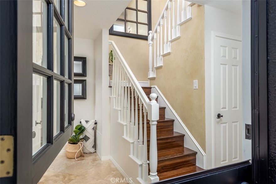 This home is a "must see."  Best opportunity in Corona del Mar Village!  This condo lives like a single family home with an attached 2 car garage and is one of the most spacious rear units in CDM. Three bedrooms (one is currently set up as an office, but includes a closet and can serve as a bedroom),  two and a half baths.  Two bedrooms and one full bath on the first floor with laundry closet (washer and dryer included).  Master bedroom, master bath, powder room, living room with fireplace, dining area, and kitchen with stainless appliances are located  on second level.  Spacious  deck off living room/ dining room, looks out over Carnation Ave. and is ideal for entertaining.  Second deck  located off master bedroom  with peek ocean view.  Large two car garage with side-by-side parking. French doors, plantation shutters, travertine flooring and hardwood flooring,  vaulted ceilings, skylights and ceiling fans are just some of the many upgrades you will find in this very bright and light beach home,  ideally located in Corona del Mar. Walking distance to  restaurants, shops, and Corona del Mar beaches. Close to Fashion Island with world class shopping and dining.