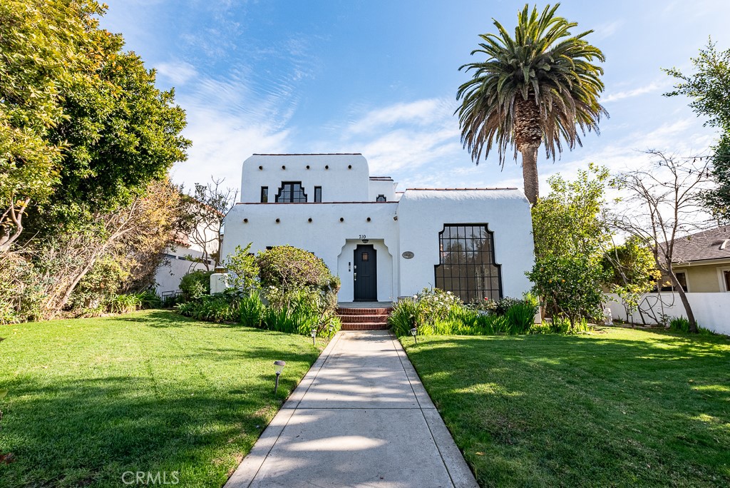 Prominently known as the Worrell “Zuni House”, 710 Adelaide Place marks its spot among the prestigious collection of Santa Monica City landmarks. The 5-bedroom, 3-bath home is complete with a two-story detached guest house, which includes an upstairs office with a 1/2 bath. Famous architect Robert Stacy-Judd drew inspiration from the two popular revival styles of the 1920s—Pueblo Revival and Mayan Revival. The high-ceiling, wide living-space is remarkably detailed yet brilliantly subtle with cube-like shapes combined and stacked to suggest the stepped-back, multi-storied communal dwellings of the Pueblo peoples. This home is adjacent to the Brentwood Country Mart, minutes away from Ocean Blvd., the famous Montana Avenue boutiques and restaurants, and The Palisades Park. This one of a kind trophy home includes a beautiful gazebo area, perfect for a romantic pool side dinner, private courtyard with swimming pool, and fire pit. This home is an entertainer's paradise and is located right by the famous Adelaide stairs. Don't miss out on this true gem.