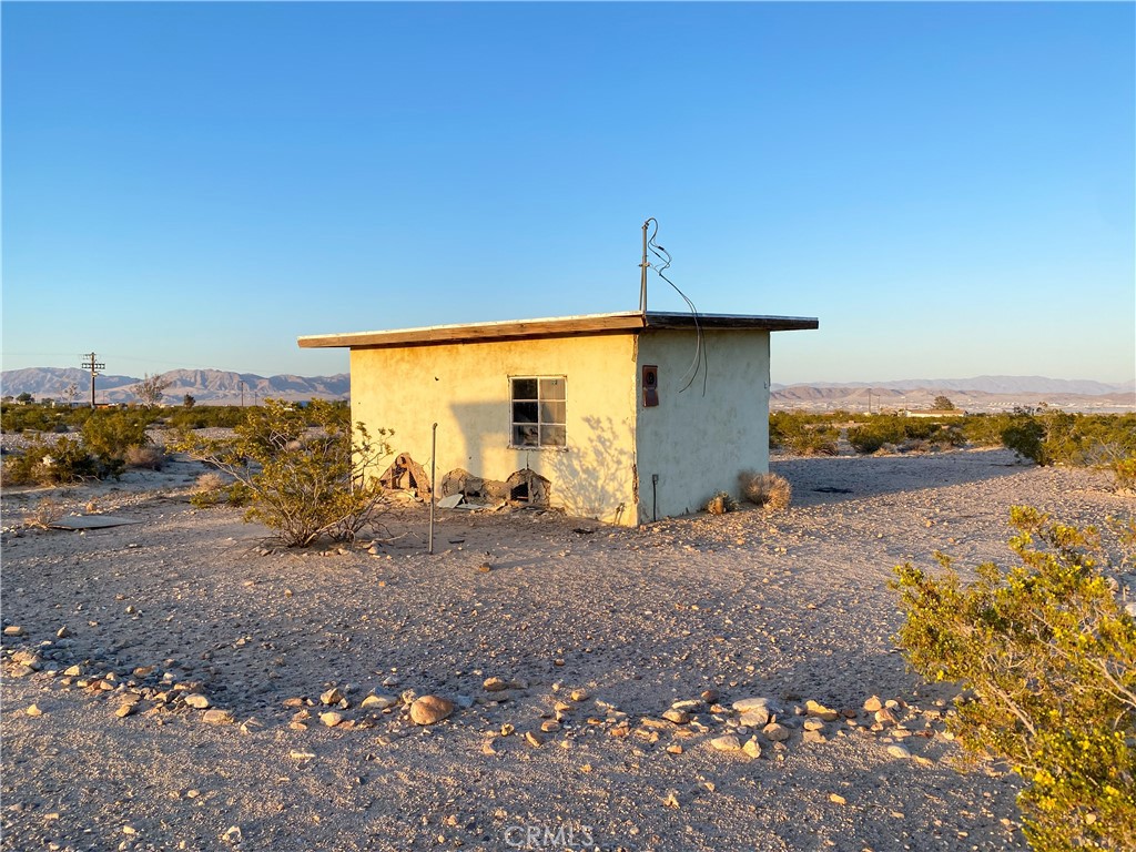 A great opportunity presents itself here with this property! This property has all you need to get started on creating your own slice of heaven! This area sits on a generous 5 acres of land! The connecting properties to the southeast include 60 acres of government-owned land, so that land will never be built on or developed! The surrounding land makes for great open views and perfect opportunities for endless outdoor activities and adventures. This property has water on-site and has had electrical power to the building with evidence of a previously installed electrical meter (see pictures). The power pole is just south of the property line by approximately 50 feet. This property is also off two main paved roads, which means easy access! With five acres of land, the possibilities are endless! Whether you want to build your dream outdoor getaway paradise, create a tranquil gardening space, or ride your quads on an adventure into the great outdoors, whatever dreams and desires you may have, this property can help make all your dreams a reality! Don’t miss out on this wonderful opportunity!