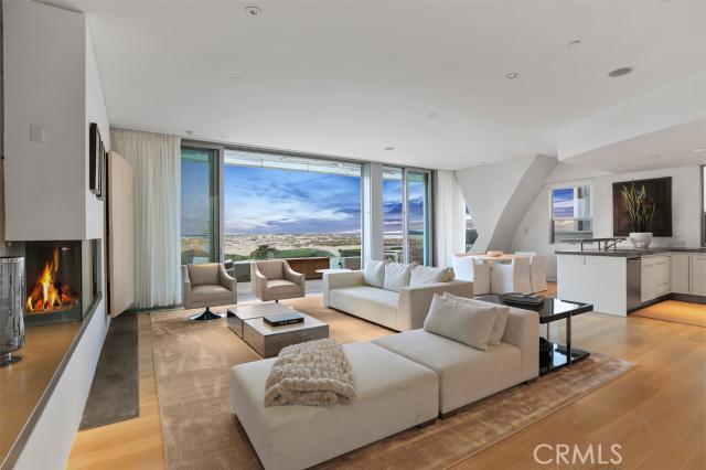 Uncluttered organic contemporary interiors and stunning architectural detail combine in one of the finest waterfront homes in Newport Beach. Just steps to the "Wedge" - with water views from every angle - the simplicity of design of this oceanfront residence evokes the fluid environment of the sea. The light, bright, open floor plan is perfect for casual seaside entertaining on any scale. Large sliding glass panels open to the sand for the ultimate indoor-outdoor beachfront living experience. Dramatic, sculptural open stairwell of steel and glass is bathed with light from above. Gracious master suite with sitting area and spa bath with wet room is highlighted by seamless walls of glass and captivating whitewater views. Two additional spacious guest areas with en suite baths. Rooftop deck with spa and fire pit captures 360 degree views of coastline, hills and sunsets over Catalina. Oversized two car garage. Often referred to as the "Sail House" on Peninsula Point this architecturally award winning contemporary home will please the most discerning buyer.