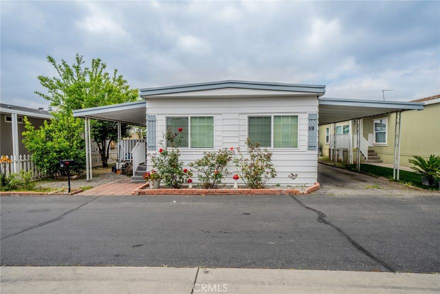 Check out this charming mobile home! This community offers a clubhouse, children's park, and community pool & Spa. The inside of the house opens to a spacious living room that adjoins the dining room and kitchen, with plenty of natural sun from nice-sized windows. This home features 3 bedrooms and 2 bathrooms—new laminate flooring. The attached carport can fit up to 3 cars. It is close to shopping, schools, and parks. Come to see this beauty before it's gone.