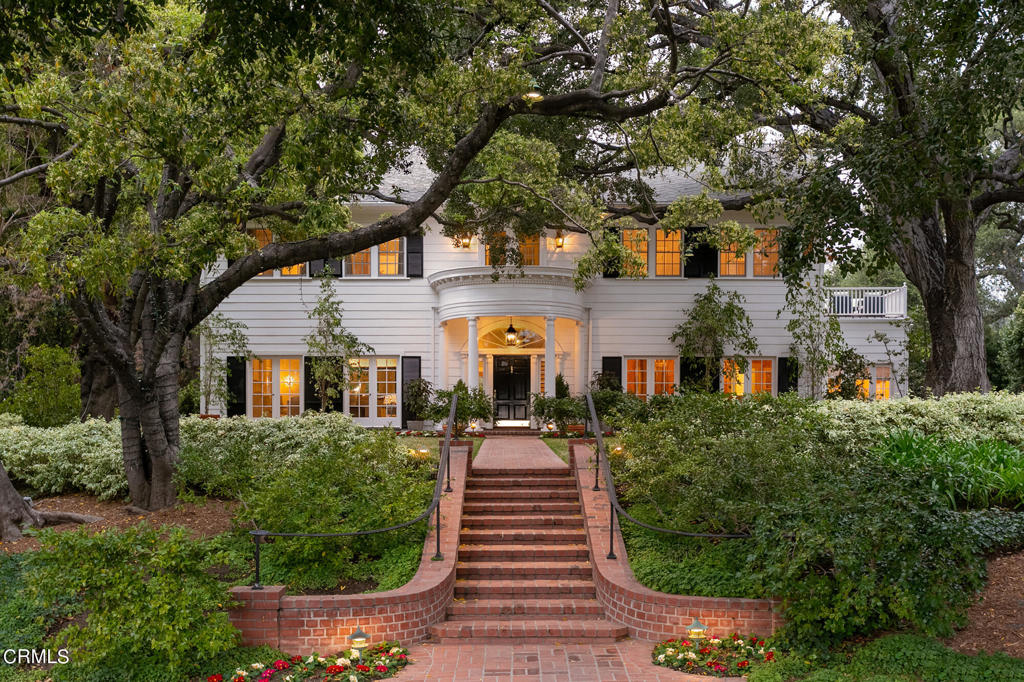 The Abraham Denman Estate / Lucille W. Luckhardt, architect. As the maiden property on peaceful Lomita Drive, this family estate prominently rises above the street, encompassing over 3/4 acre of nearly flat landscaped grounds and 6,301 sf of living space - featuring the main residence, guest house, expansive lawns, pool/spa, terraces, and outdoor sojourns, as well as a 3-car executive garage. Grand public areas commence with a majestic foyer, flanked by formal living and dining rooms, each with french doors that flow out to brick pavers and lawns. Chef's kitchen with adjoining great lounging room - all leading to the outdoors - provide abundant space for more casual entertaining. Private first-floor bedroom and bath provide for separate guest accommodations. Butler's pantry and bar, separate breakfast room, paneled library with fireplace, powder and laundry room. Exquisite finishes such as de Gournay Chinoiserie papering, custom cabinetry, and millwork throughout. The sweeping staircase leads to the primary wing with spacious bedroom suite, dual walk-in closets and opulent bathroom. In addition to an intimate office with balcony, three guest bedrooms, two baths and service staircase completes the second level. Outdoor entertaining areas include numerous patios, a large swimmers pool with spa and entertaining pavilion. Landscape design by Mark Berry and masonry by Bob Cook. Guest house with bathroom allows for additional visitors or a teen respite from parents.