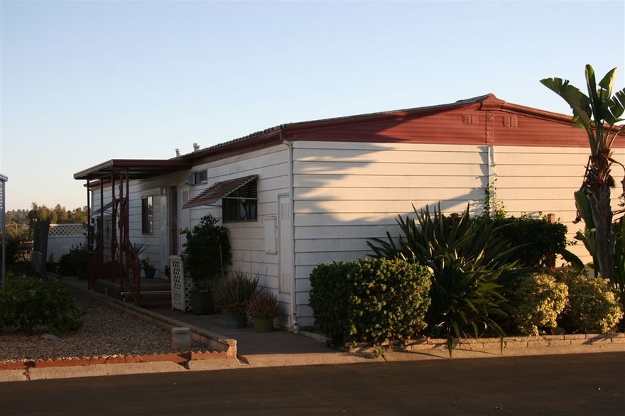 Resident owned park with the amenities and social activities found in a senior living park.  SW Escondido convenient to all. Views of surrounding hills from the home. SPACIOUS ROOMS with LOTs of GREAT STORAGE, walk in closets, dining and living room built in cabinetry. Don't miss the full length closet off the Family room! ENCLOSED FINISHED PATIO ROOM is a BONUS not included in square footage. PRIVATE PATIO area in rear.  Kitchen open to Family room.  Newer A/C and water heater! Pets allowed on approval! Neighborhoods: W Valley Pkwy, Auto Pkwy Complex Features: ,, Equipment:  Dryer, Shed(s), Washer Other Fees: 47 Sewer:  Sewer Connected Topography: LL