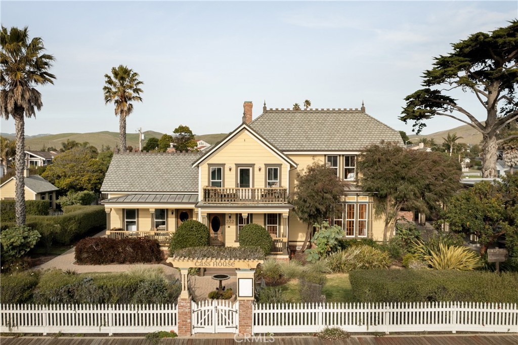 A turnkey chance to own a charming Bed & Breakfast, an artisanal Bakery, a stylish Bar & Grill, and a versatile Wedding & Event Venue—all in the heart of downtown Cayucos, just one block from the ocean.
Originally built in 1875 by Captain Cass, the iconic Cass House is a 30,000 sq ft (0.68-acre) estate zoned for commercial use, offering significant potential for hospitality, retail, or private residential purposes.
This landmark property features four distinct structures, including the renowned Bijou Bakery. The main residence, beautifully restored to its 1876 grandeur, includes ensuite bedrooms, a reception area, a banquet room, a formal dining room, and a commercial-grade kitchen. A picturesque wedding arbor and expansive lawn provide an idyllic event setting, while a guest house offers additional accommodations or on-site management space. The property also includes cold storage, dry storage, public restrooms, on-site parking, and established gardens, perfect for farm-to-table dining.
The fully equipped restaurant space, formerly the Cass House Bar & Grill, is ready to reopen with a wood-fired oven, professional-grade kitchen, full bar, and an alfresco dining pavilion with retractable covers. The Bijou Bakery currently operates under a month-to-month lease, giving the new owner flexibility to renegotiate terms or explore new opportunities.
The Cass House, originally priced at 5 million more than a decade ago, was acquired in 2014 for 2.5 million. Substantial investments were made to redevelop the property, including the addition of new structures like a bar & grill, bakery, outdoor pavilion, storage, restrooms, and parking facilities. Throughout the development process, the property's original architecture was carefully preserved to ensure its charm and character were maintained. This project required dedication and passion to bring to fruition.
Accessible from 149 Cayucos Dr. and 222 N. Ocean Ave., this rare investment offers a blend of history, oceanfront proximity, and commercial potential in a thriving coastal community. Whether as a hospitality business or private estate, the Cass House is an extraordinary opportunity to own a piece of California history.