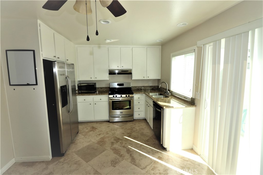 Beautiful upgraded GROUND FLOOR home with 3 bed 2 bath. Perfect location across the street from pool and park. Two minute walking distance to North Lake and Tennis courts. Enter into light and bright spacious living room overlooking pool and park across the street. Remodeled BIG eat-in kitchen has stunning NEWER Granite Counter, tiled floor NEWER stove/oven NEWER dishwasher, and leads to cozy patio great for enjoying BBQ and relaxing outdoors. Bathrooms remodeled with separate shower NEWER bath tub and dual vanity's. Fully enclosed patio spacious lock up storage and leads to 1 car carport Woodbridge is one of Irvine's most sought after neighborhoods with 2 beautiful lakes for fishing and boating, numerous award winning schools, lots of green areas 2 beach lagoons and over 24 pools 16 spas, 13 waders, 24 tennis courts numerous parks with play equipment.