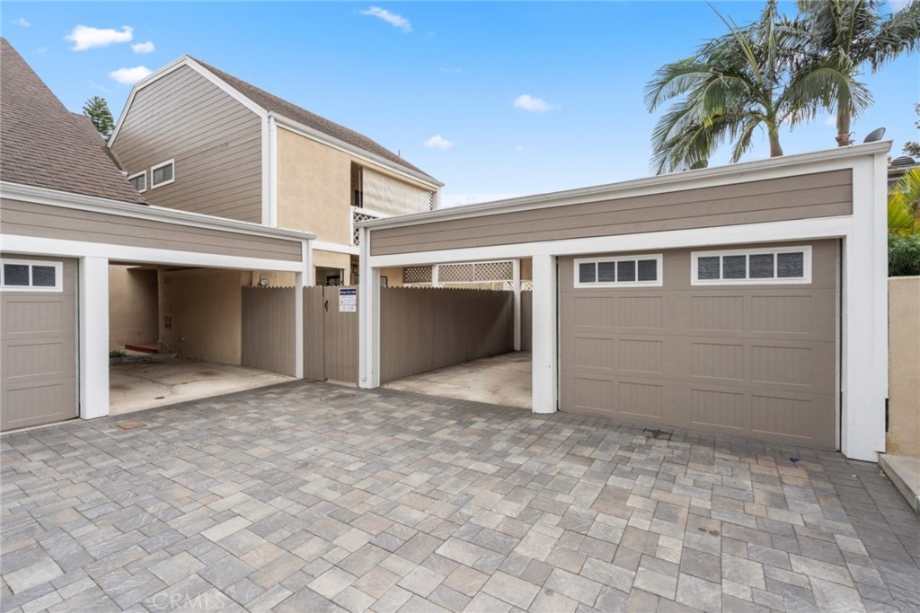 Just in time for the Holidays! Purchasing this sharp townhouse is a great way to start a brand new year! Refreshed throughout, this 3 bedroom, 3 bath end-unit townhouse unit is in turn-key, move-in condition. A large primary bedroom upstairs features a generous sized walk-in closet, a private full bathroom, and a sliding door to a deck with an elevated view of the well kept community pool and spa area. It shares the second story with two additional large guest bedrooms that over look the rear patio and yard. The large living room off the front entry and half-bathroom includes a fireplace, and overlooks an uncommonly large back patio, hardscaped planters, and a grassy yard area too. The patio and yard features of this property are not easily replicated in most similar developments. Another private front patio is easily accessed from the kitchen and dining area entry door. A covered carport and single car garage are conveniently located just outside the rear gate of this patio. This is a very sharp, well cared for complex with a cool, contemporary edge. The large & secure central community area of the complex with a pool, spa, & outdoor dining/entertaining area are a great additional asset. The complex is located in a quiet but convenient Eastside neighborhood location, in close proximity to the Back Back Nature area, shopping and dining on East 17th Street, as well as easy transportation access. You won't want to miss this great opportunity, so act quickly!