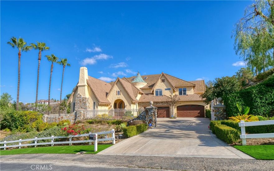 Nestled in the prestigious enclave of The Country Estates, this stunning custom estate embodies refined luxury and timeless elegance. Sprawling over 6,726 square feet of meticulously designed living space, this two-story masterpiece offers six spacious bedrooms and seven exquisite bathrooms, ensuring ample room for both lavish entertaining and intimate family living. Upon entering the grand formal entryway, visitors are greeted by soaring ceilings, striking marble and hardwood floors, and an ambiance of stunning sophistication. The home's layout is thoughtfully arranged with an oversized living room, a gracious formal living area, and a welcoming family room that radiates warmth and charm. Every detail has been carefully curated and updated, from the entirely re-piped systems to the modernized, luxurious bathrooms. The gourmet kitchen is a chef's dream, equipped with top-of-the-line built-in appliances, a generous walk-in pantry, and elegant finishes that promise both functionality and style. Each spacious bedroom suite, including a lush primary retreat, provides a serene sanctuary with refined touches that enhance the sense of calm and comfort. The primary bedroom is spacious, completed with a fireplace, huge walk-in closet, covered viewing deck, marbled bathroom with large vanity, dual sinks, walk-in shower, separate soaking tub, private commode, and magnificent views. Beyond the interior, the property truly shines. Step outside into a breathtaking landscape designed for entertaining and relaxation. The expansive grounds feature a private putting green, a sparkling pool and spa, and a charming gazebo, all set against a backdrop of mesmerizing panoramic city lights and majestic mountain views. The park-like setting offers a peaceful escape, making it the perfect venue for both lively gatherings and quiet evenings under the stars. This beautiful and functional custom estate is more than a simple home, it is a statement of luxury, comfort, and impeccable taste in one of the most coveted communities.