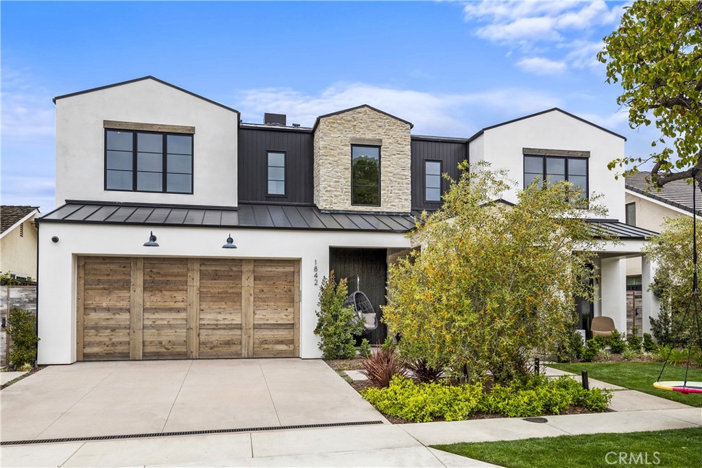 Welcome to the highly coveted Harbor View community, known by locals as the Port Streets. This family friendly neighborhood boasts some of the most exclusive properties in Newport Beach. This stunning custom home, located at 1842 Port Westbourne Place, is a rare find that offers the perfect combination of luxury living and family life. Located one block away from award winning Anderson-Elementary School, this inner loop home offers 5,310 square feet of living space on a 6,300 square-foot lot, making it an entertainer's paradise.
A grand, tumbled stone entrance invites you into the home's main level featuring indoor-outdoor dining, a Venetian plastered fireplace, and spacious ensuite bedroom. The completely custom kitchen boasts white oak cabinetry, a 6-burner double Wolf oven, 30-inch Sub-Zero refrigerator and freezer and designer waterstone faucets. The oversized island has plenty of bar seating for those casual family nights or large dinner parties. The butler's pantry features a built-in microwave and a Subzero wine refrigerator, leading into the oversized dining room with La Cantina sliding doors that open out to the home's front porch. The resort style backyard and sparking custom pool can be seen from every angle of the home's main level. The outdoor fireplace and spa create the ultimate California oasis.
Following the French oak floors downstairs you will find a 1,300 square-foot basement, the perfect entertainment room equipped with luxury bar, built-in cabinetry, and an ensuite with private entrance. This rare feature makes for the ultimate mother in-law suite, teen hangout room or movie theater.
The home's primary suite, located on the second story with beautiful views of the backyard, features a luxurious soaking tub, oversized walk-in closet and cozy fireplace making the perfect relaxing retreat. Just down the hall you will find four more ensuite bedrooms each with a walk-in closet. This home offers plenty of functionality. Additional features of this home include a spacious laundry room fit for two sets of washer and dryers, two tankless water heaters, pre-wiring for an electric car charger, and fully wired security cameras inside and out.