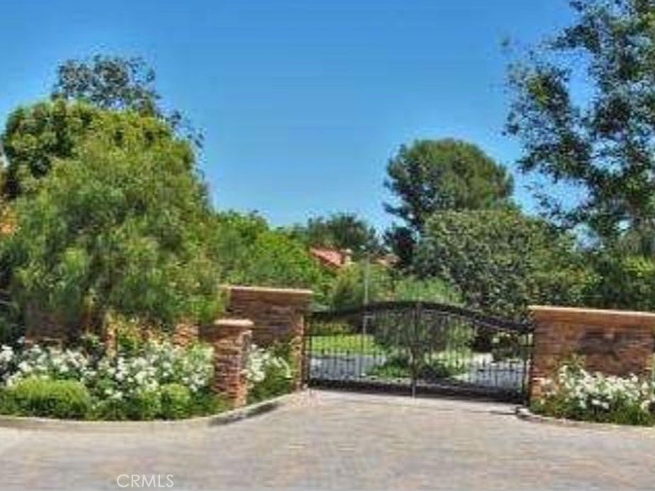 This outstanding furnished home located on a quiet interior cul de sac in the gated community of Turtle Rock Pointe. Natural light floods into the home all day in this very quiet, peaceful setting. This end unit offers pastoral views of Shady Canyon, Sand Canyon Reservoir, Strawberry Farms, and hillside canyons. Highlights include: Hartmark dark brown walnut glazed cabinets in the kitchen, master, and 2nd floor bath, Viking 6 burner gas cooktop, Jennair French door refrigerator, marble/granite counters throughout, vinyl windows and doors, hardwood floors on first level, added recessed lighting throughout, updated faucets and fixtures, custom window coverings, home office cabinetry on first floor (office could be the a main floor bedroom), garage storage built-ins, AND MORE!! Highest quality craftsmanship will give you an easy lifestyle so start packing now!! Turtle Rock Pointe is assigned to some of the best schools in Irvine; award winning Rancho San Joaquin Middle School, University High School and Bonita Canyon Elementary School.