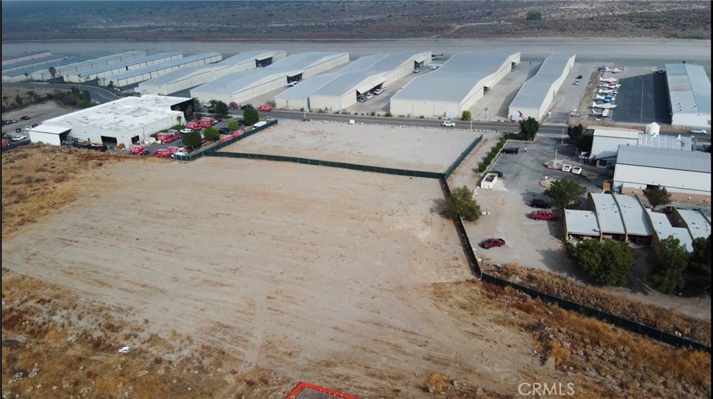 Lot can be purchased or leased , Industrial zoned . This graded land is great with lots of potential , it is permitted for Truck and Trailers parking permitted. Recreational vehicle storage allowed . Ideal for outside storage , lay down yard. RV storage allowed , Auto Auction and Contractor's Yard. This lot is great and spacious with easy access to 10 & 210 Freeways. Yards are fenced and have screened area, partially slagged yard area. Two Curb Cuts. Yard can be built on , for custom built , verifying zoning : http://www.cityofredlands.org/zoning