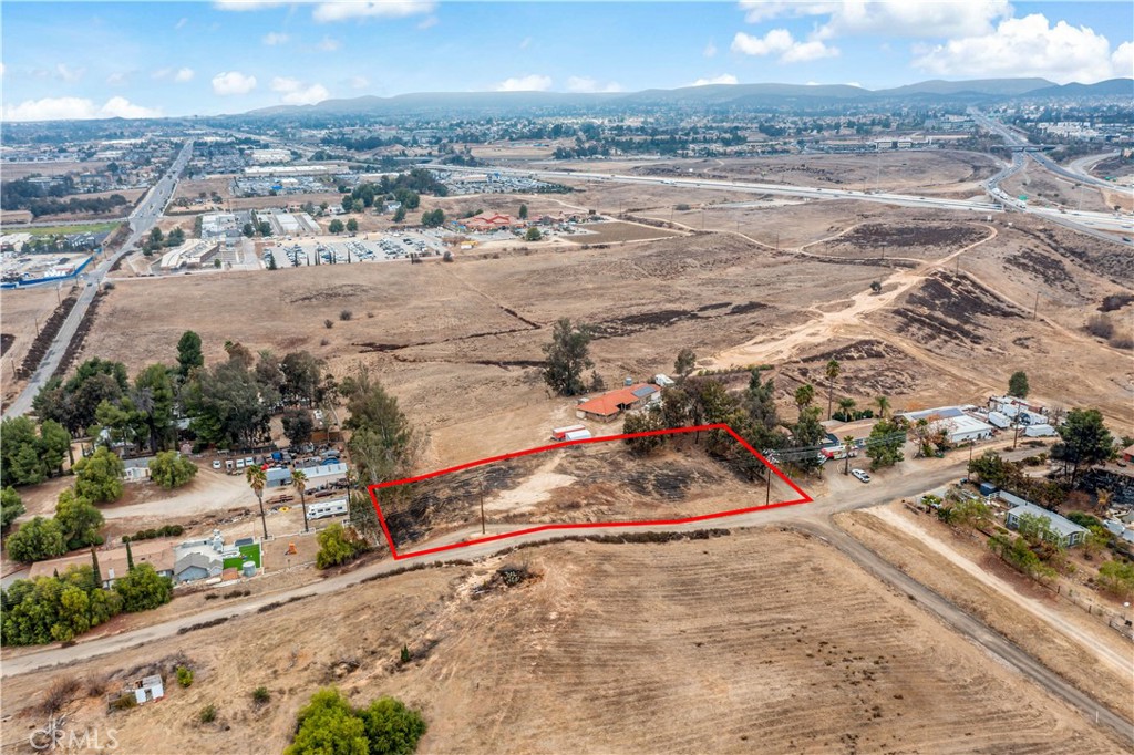 Stunning views await on this 1-acre lot and the property is nestled within a neighborhood of beautiful homes. Conveniently located near schools, shopping centers, and freeways, this lot offers excellent potential. No HOA fees add to the appeal. Buyers are encouraged to verify all information with the city and conduct their due diligence. Close to all the commerce and development on the West Side in Murrieta, this could be a potential medical office, business. Commercial property is nearby. This property may qualify for conventional land financing—don’t miss this fantastic opportunity! As per the City of Murrieta, this zoning has been changed to Innovation Zoning. Please contact Jill for the details. I have the print out from the City of Murrieta. No Residential allowed, more of Commercial, Medical, etc.