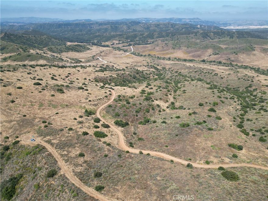 20 unique gated acres, located behind & overlooking San Clemente with some small ocean views, adjacent to Rancho Mission Viejo Reserve, just minutes away from the new city of Rancho Mission Viejo, San Juan Capistrano and San Clemente.  The property has over a 1,000 ft. elevation with breathtaking 360° views & a gorgeous canyon with large oaks and other native trees.  It was previously owned by the famous Actor James Cagney for 50 years. Orange County Line.