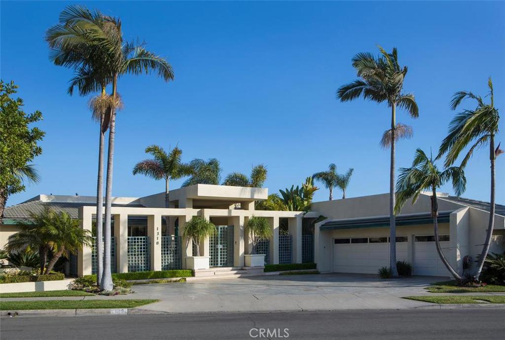 This glorious estate graces one of the largest and best lots in the coveted Dover Shores area. Situated on an approximately 20,000 square foot lot, the residence revels in panoramic ocean, Back Bay, and city lights views from its romantic setting. Exquisite modern architecture draws you in immediately to this 6,418 square foot estate. The home is comprised of four bedrooms plus an office, a formal great room which opens to the spectacular veranda with unparalleled views, a magnificent chef’s kitchen, separate living room, and formal dining room. The private master suite features a separate retreat, spa-inspired bath with steam shower, and a gym area with a sauna. The extensive, private grounds encompass a refreshing pool and separate spa, and built-in fire pit. Few homes in Dover Shores offer such a unique combination of setting, space, views and privacy.