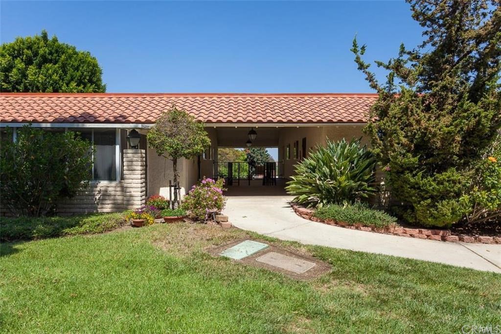 Remodeled 2 Bedroom and 2 Bathroom condo located in beautiful 55+ Senior Community of Laguna Woods. NO STAIRS, NO ONE ABOVE, SINGLE LEVEL, STEPS TO CARPORT. New Front Door opens to an inviting and spacious Living Room with beautiful laminate flooring, scraped ceilings, designer paint, crown molding and energy efficient dual pane windows and sliding doors throughout. Living Room opens to a private patio with views perfect for morning coffee or afternoon tea. Remodeled kitchen offers crisp white cabinets, granite counters, stainless steel refrigerator, recessed lights and skylight. Remodeled bathroom features walk-in shower with sliding glass door, shaker cabinets, granite counter, designer fixtures, new tile flooring and privacy window. Second bathroom also features granite counter, newer fixtures, tile flooring... Walk-in closet, stackable washer & dryer. Don't miss this move in ready condo, 10 minutes to Laguna Beach, close to shopping... NOTE: Living Room, Dining Room and Bedroom photos are virtually staged.