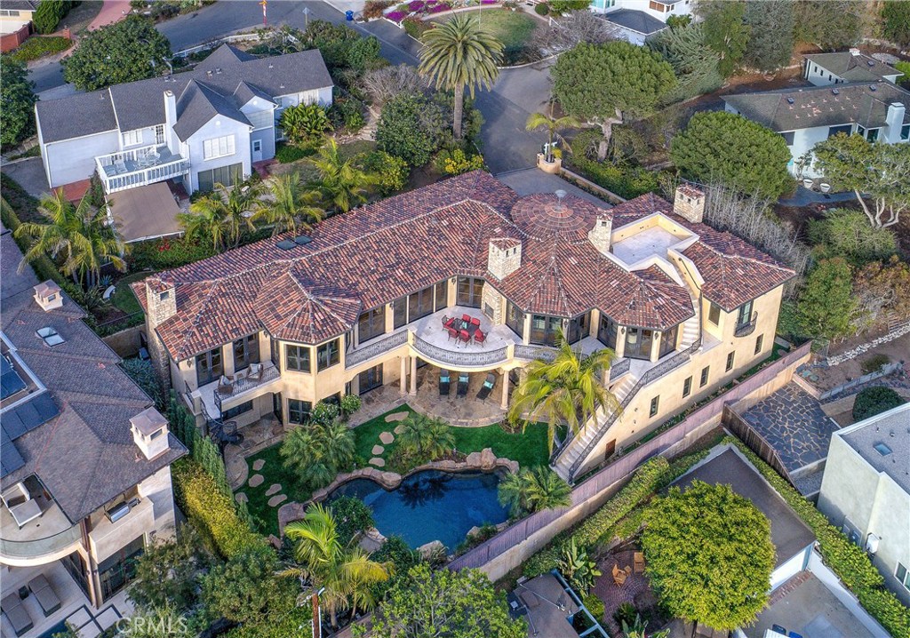 This provincial villa offers authentic statements & architectural details that blend an early California lifestyle with a Riviera feel everywhere you look. This is one of only two gated hillside estates in this coastal community. Perched high above the Pacific, on a huge 9,600sf lot with 122 lineal feet of Southern exposure, this incredibly beautiful home is a private sanctuary with breathtaking ocean views from Malibu to Catalina & Palos Verdes Peninsula. This Louie Tomaro designed masterpiece embraces warmth & sophistication with imported Italian plaster ceilings, fine walnut cabinetry, wood beamed ceilings, travertine, hickory, and walnut flooring, plus seven natural stone fireplaces! The professional kitchen boasts a beautiful Azul Macauba island with ocean views at every corner. This exquisite estate features a lavish pool, spa and grotto, 1,000 bottle wine cellar, library, state of the art security system, billiards room, rooftop deck, and an 8 seat movie theater which includes a 120" screen and wet bar. This private, elegant estate truly is the definition of paradise. All information to be independently verified by buyer. Square footages shall also be independently verified by buyer.