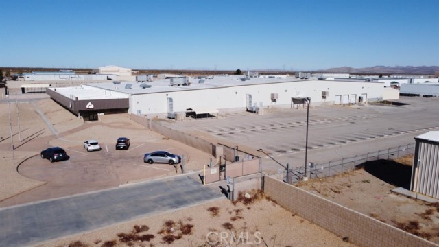9400 Holly Road. (the property''), a unique opportunity to acquire a 71,246 SF facility on a 405,979 SF lot. This expansive facility consists of 5 Ground Level Doors, A truck well with 4 dock high doors, Fire Sprinklers throughout, five (5) restrooms, seven (7) offices, 6 unsecured free surface parking spaces in front of the building, 75 free surface parking spaces on a secured lot on the east side of the building . The building is serviced by City of Adelanto water, sewer, Southern California Edison, and Southwest Gas. The facility has (2) two separate main switchgears providing 1,200 Amps of 480/277 Volt, 3 Phase Power and 4,000 Amps of 480/277 Volt, 3 Phase Power (5,200 AMPS of existing power in the building) and High Voltage Distribution Spur providing Onsite Power at a massive 12 KV (12,000 volts) . This is an outstanding opportunity for an investor or operator to own a well-suited facility for cannabis cultivation with exceptional upside or perfect for a traditional industrial user. This property also has the ability to expand relatively quickly for an additional 30,000 SF off the midpoint and the NW corner. As well as the ability to expand by an additional 100,000 SF with the expectation of relocating the power distribution spur.